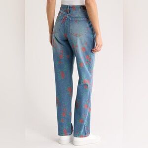 Stylish Blue Jeans with Red Floral Pattern